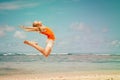 Teen girl jumping on the beach Royalty Free Stock Photo