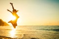 Teen girl jumping on the beach Royalty Free Stock Photo