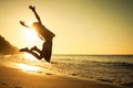 Teen girl jumping on the beach Royalty Free Stock Photo