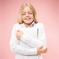 Teen girl with laptop. Love to computer concept. Attractive female half-length front portrait, trendy pink studio Royalty Free Stock Photo