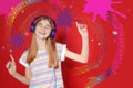 Teen girl listening music with headphones on background Royalty Free Stock Photo