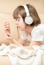 Teen girl listening music with the headphones Royalty Free Stock Photo