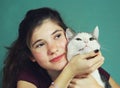 Teen girl with long brown hair and cat Royalty Free Stock Photo