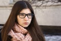 Teen girl with long brown hair in eyewear myopia glasses