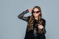 Teen girl with long curly hair wear trendy sunglasses, fashion Royalty Free Stock Photo