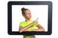Teen girl looking through digital tablet frame pointing finger to side Royalty Free Stock Photo