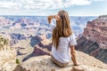 Teen girl looks out over the vast canyon Royalty Free Stock Photo