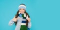 teen girl with nasal spray. no addiction to medicals. copy space. kid in warm sweater feel cold Royalty Free Stock Photo