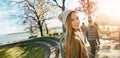 Teen girl in nature with friends, walk in park with autumn and sunshine, wellness with happiness in portrait. Youth