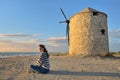 Teen girl and Old windmill ai Gyra beach Royalty Free Stock Photo