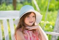 Teen girl outdoors, close-up. Portrait of attractive little teen with beautiful happy smiling face. Nature childhood Royalty Free Stock Photo