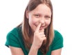 Teen girl picking her nose