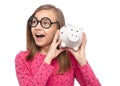 Teen girl with piggy bank Royalty Free Stock Photo