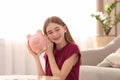 Teen girl with piggy bank Royalty Free Stock Photo