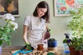 Teen girl plants small cactus in pot. Hobbies and leisure, home gardening, houseplant Royalty Free Stock Photo