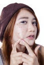 Teen girl pressing her pimple Royalty Free Stock Photo