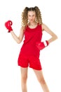 Teen girl in red boxing gloves working out in gym Royalty Free Stock Photo