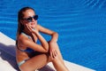 Teen girl relaxing near swimming pool Royalty Free Stock Photo