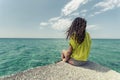 Teen girl relaxing by the ocean Royalty Free Stock Photo
