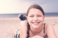 Teen girl resting lying on the beach Royalty Free Stock Photo