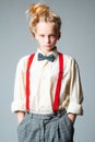 Teen girl in retro male suit. retro fashion model. vintage charleston party. jazz step fashion. suspender and bow tie