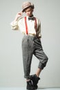 Teen girl in retro male suit. retro fashion model. vintage charleston party. suspender and bow tie. old fashioned child