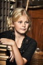 Teen girl in retro style with a stack of books Royalty Free Stock Photo