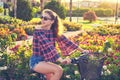 Teen girl riding bicycle in a city flowers park