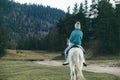 Teen girl riding a horse on meadow Royalty Free Stock Photo