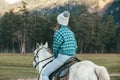 Teen girl riding a horse on meadow Royalty Free Stock Photo