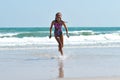 Teen girl running on the beach. Happy child on the sea Royalty Free Stock Photo