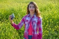 Teen girl selfie video photo spring meadow