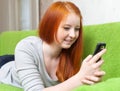 Teen girl sends SMS Royalty Free Stock Photo