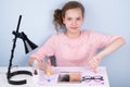 Teen girl shows her hands good and bad, on the table lie glasses and lenses to improve vision Royalty Free Stock Photo