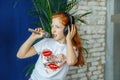 A teen girl sing a song in a microphone. is childhood, lifestyl Royalty Free Stock Photo