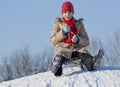 Teen girl sledding Royalty Free Stock Photo