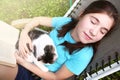 Teen girl sleep in chaise lounge with cat Royalty Free Stock Photo