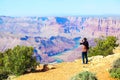 Teen girl taking pictures at the Grand Canyon Royalty Free Stock Photo