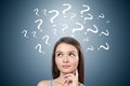 Teen girl with too many questions, dark gray Royalty Free Stock Photo