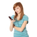 Teen girl using cell phone Royalty Free Stock Photo