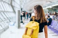 Teen girl waiting for international flight in airport departure terminal Royalty Free Stock Photo