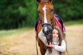 Girl walks with her beloved horse Royalty Free Stock Photo