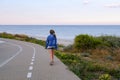 Teen girl on a walkway along the coast Royalty Free Stock Photo