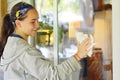 Teen Girl Washing Windows