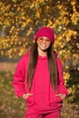 teen girl wear sunglasses. autumn fashion girl. trendy and stylish teenager girl smiling. fall fashion style for teen Royalty Free Stock Photo
