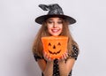 Teen girl in witch black hat