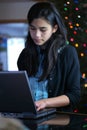 Teen girl working on laptop