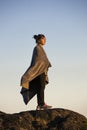 Teen wrapped in blanket in golden light Royalty Free Stock Photo