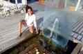 Teen girl 11 years with a fountain in a spa Royalty Free Stock Photo