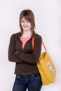 Teen girl with a yellow bag Royalty Free Stock Photo